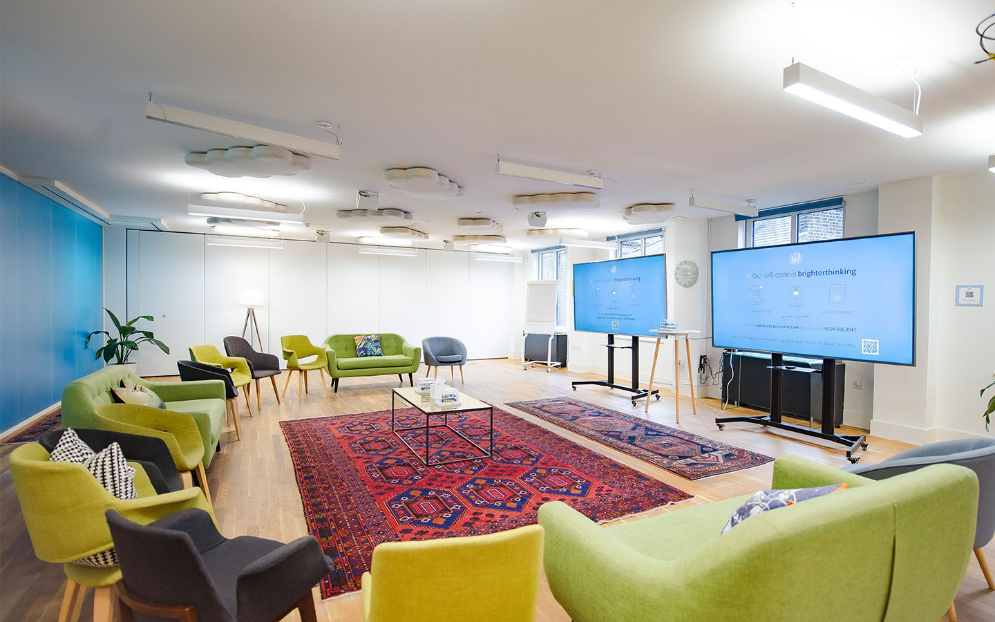 Large meeting room space able to accommodate up to 150 people with bright soft colour seating, enhanced acoustics and large monitors